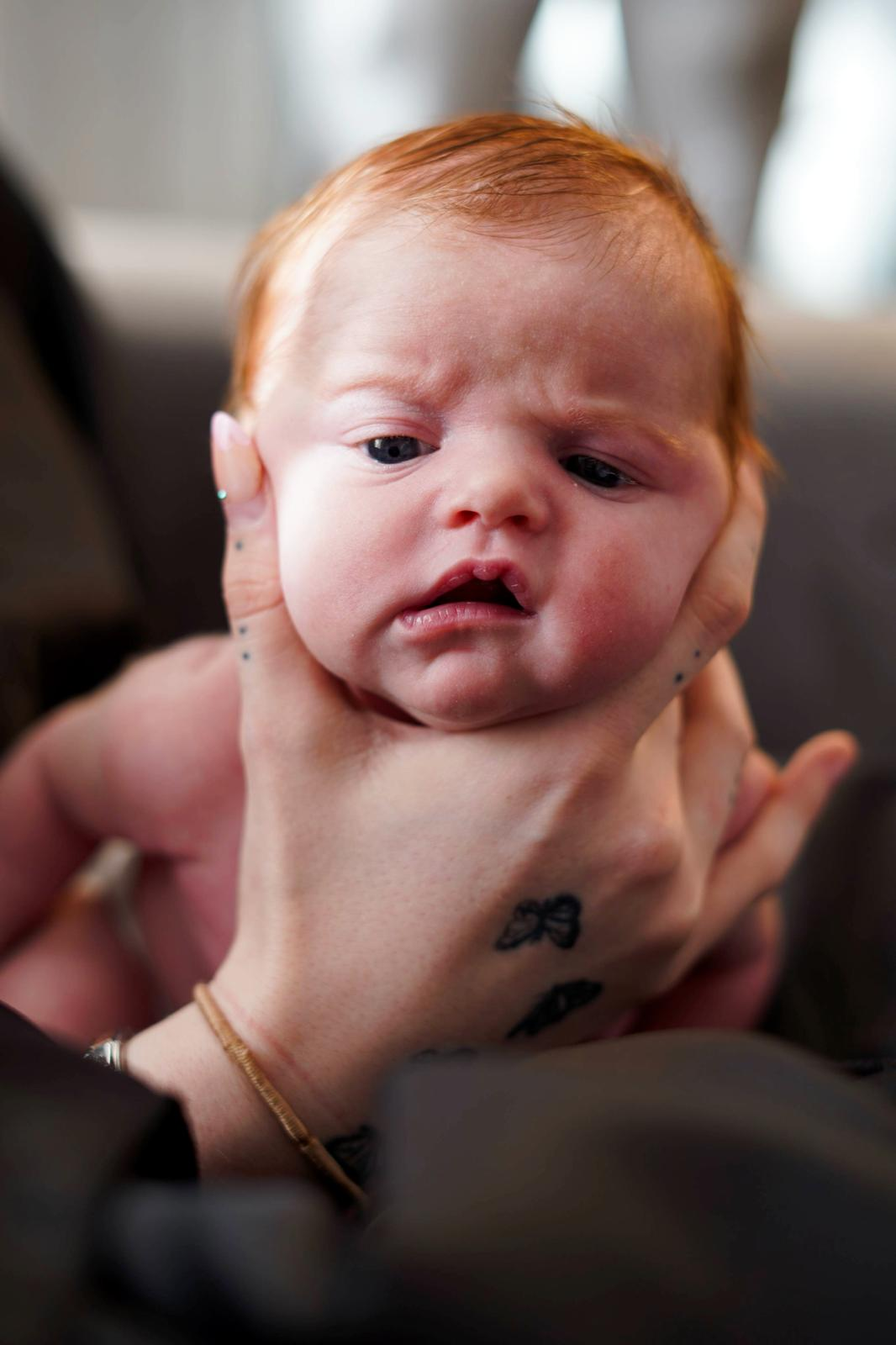 Close portrait of red-haired newborn